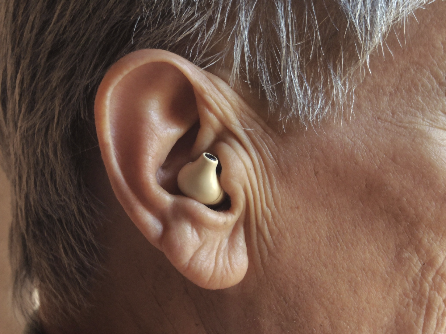 Discreet Hearvelle earpiece worn in the ear